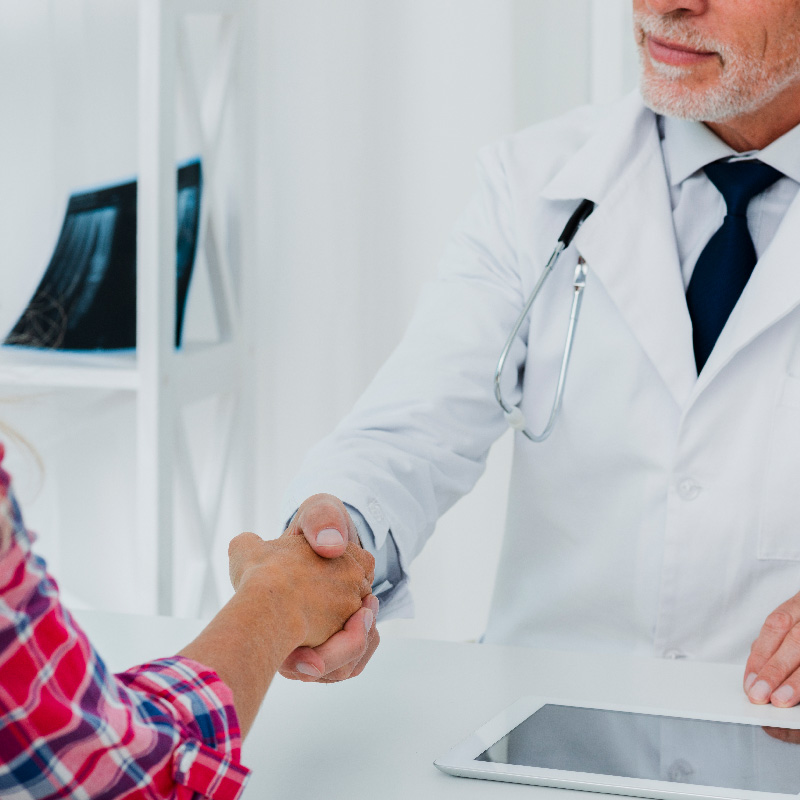 doctor shaking hand patient